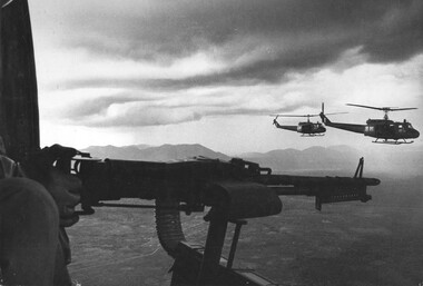 A photograph of Huey 'slick' Helicopters from 9 Squadron, RAAF loaded with seven fully equiped infantry soldiers plus the four RAAF crew. 