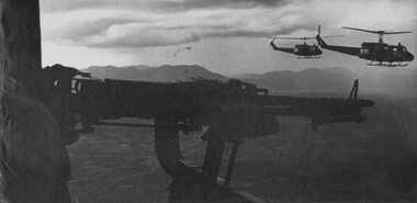 A photograph of RAAF Huey 'slick' Helicopters transporting Diggers from the 1st Australian Task Force Base, Nui Dat, Phuoc Tuy Province. 