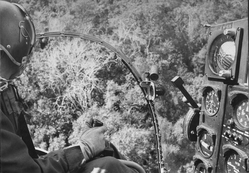 A photograph of a rotary (helicopter) wing 'Possum' aircraft from 161 (Indep) Recce Flight, stationed at the 1st Australian Task Force Base. 