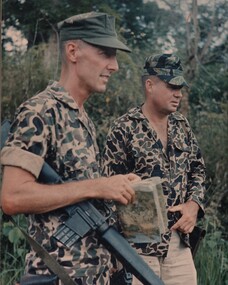 A photograph of Capt Len Opie and WO1 Bill Birkett, of the AATTV, at the special forces camp at Lake Lac Thien. 