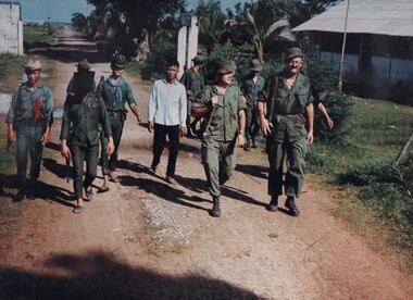 A photograph of two members of the AATTV operating with a local Vietnamese Regional Force Unit in the Mekong Delta of IV Corps. 