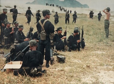 A photograph of a member of the AATTV supervising the traning of Chinese (Nung) Mercanaries at the Mike Force Training Area,  Marble Mountain. 