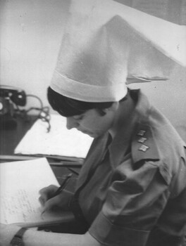 A photograph of Capt Pam West in the medical ward Sisters Station at the 1st Australian Field Hospital, Vung Tau. 