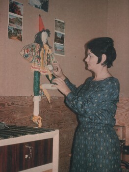 A photo of Lt Colleen Mealey as she brightens up her quarters with a feature wall at  "Fort Petticoat" at 8 Field Ambulance Hospital. 