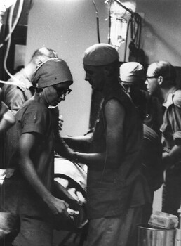 A photograph of Sister June Minchow, Medics Alex (Chuck) Berry and Pte Peter Carey (1st Australian Field Hospital) and CO  Lt Col Mike Naughton.