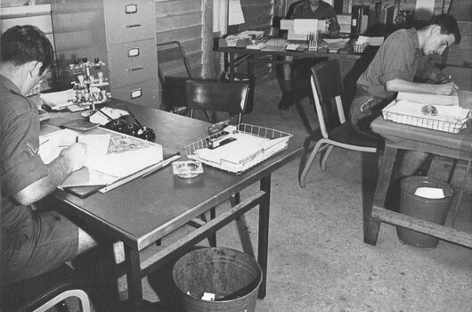 A photograph of clerical staff at the orderly room and pay office of the 1st Australian Field Hospital, Vung Tau.