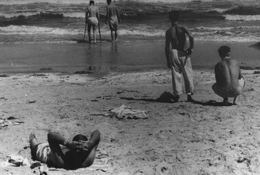 A photograph of Pte Dave Henderson, wounded forward scout from 8 RAR, enjoys a paddle with a patient mate from the 1st Australian Field Hospital.