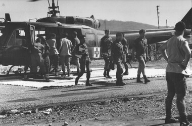 A photograph of 1st Australian Field Hospital, Vampire Helicopter pad,, US Army Dustoff 45 casavac helicopter, delivers wounddc VietCong, 