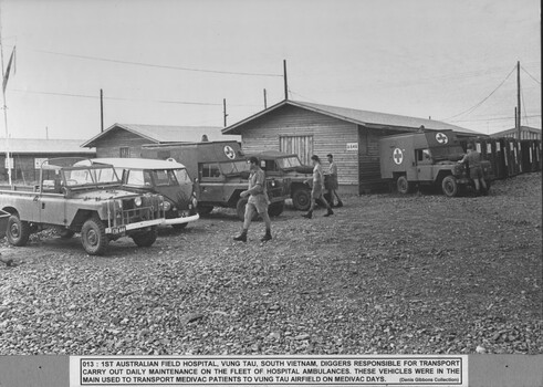 A photograph of 1st Australian Field Hospital, Vung Tau, South Vietnam, Diggers responsible for transport carry out daily maintenance on the fleet of hospital ambulances.