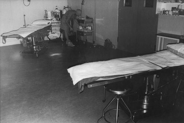 A photograph at 1st Australian Field Hospital, Theatre Sister Captain June Minchow, checks the stores and equipmentment in the operating theatre. 