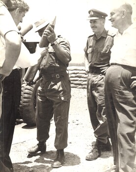 A photograph of Maj Gen Doug Vincent, the Australian Force,  with New Zealand politicians visiting st Australian Task Force Base, Nui Dat, Phuoc Tuy Province.