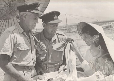 A photograph taken at Phang Rang, Flt Sgt Al Thomas and Sgt Ray Morrison of 2 Sqn RAAF shelter from the midday sun. 