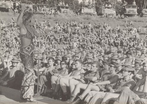 A photograph at Nui Dat December 1971. Lorrae Desmond gives a concert to the Diggers during the show's tour of bases in the war zone.