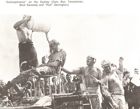 A photograph of Schizophrenia on HMAS Sydney. A digger is given a shower during the "crossing of the line" ceremony.  