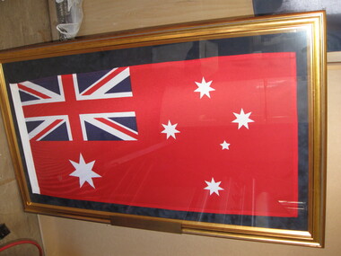 The union jack is enclosed in a gold frame.  