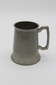 Small pewter tankard with a glass bottom with personal engraving.