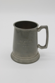 Small pewter tankard with a glass bottom with personal engraving.