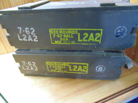 A wooden ammunition box with details of size of the ammunition and how many rounds