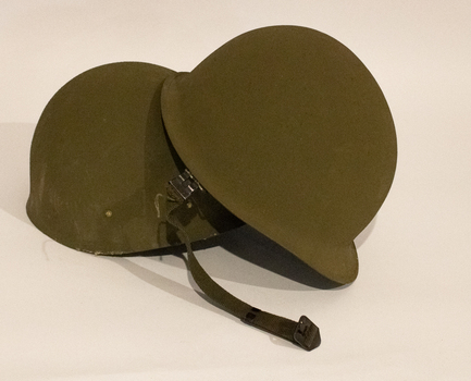 Khaki complete steel helmet with chinstrap plus inner helmet with headband.