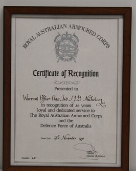 Printed document of recognition of 35 years service in the Royal Australian Armoured Corps with name of recipient, date, and certificate number in fancy calligrap