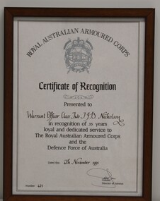 Printed document of recognition of 35 years service in the Royal Australian Armoured Corps with name of recipient, date, and certificate number in fancy calligrap