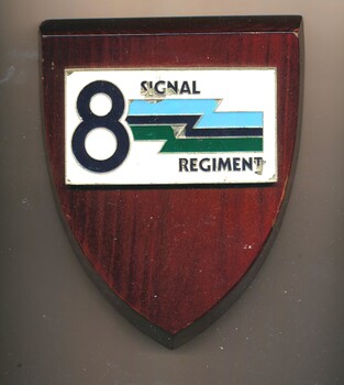 Wooden shield bearing the emblem of 8th Signals Regiment of the Australian Army Reserve.