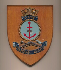 Wooden shield bearing the coloured emblem of HMAS Sydney and the motto, 'Thorough and Ready"