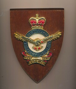 A wooden plaque with Royal Australian Air Force insignia