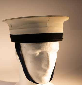 A white sailors hat with a black chin strap worn on ceremonial occasions.