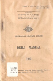 A cream coloured booklet Drill Manual with a plastic cover. There is sings of discolouration of the plastic.