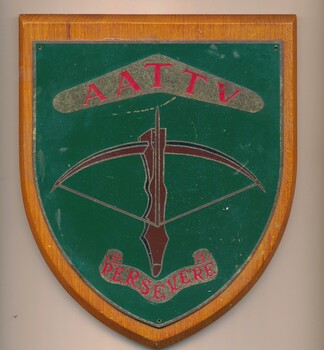 A wooden plaque commemorating the AATTV-persevere.