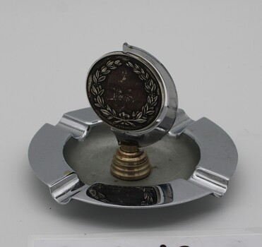 Standard electro plated ashtray mounted with medallion to 2 recruit training battalion with the number 2 over pair of boomerangs