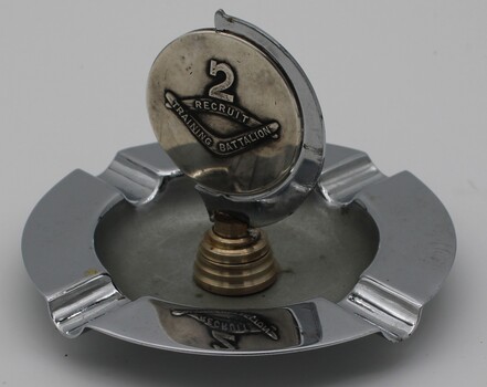 Standard electro plated ashtray mounted with medallion to 2 recruit training battalion with the number 2 over pair of boomerangs