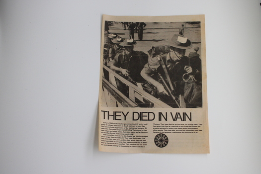 A an article showing troops in uniform boarding a ship off to the Vietnam conflict. 