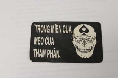 A death card that was left on the bodies of dead VC soldiers.