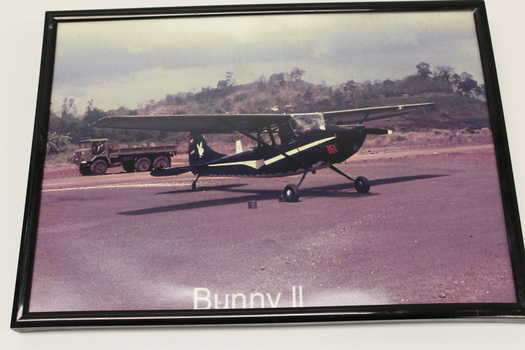 A photograph of a small black plane with 161 in red near the nose. Vietnam (1962-1972)
