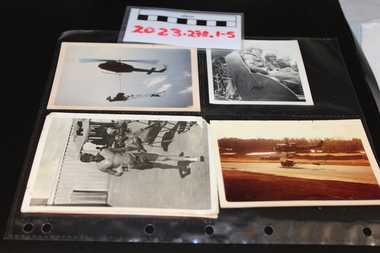 Five coloured photographs of helicopters and personell from the Vietnam war (1962-1972)