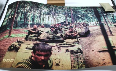 Coloured photo of B Coy 4RAR/NZ returning back to base on APC's.