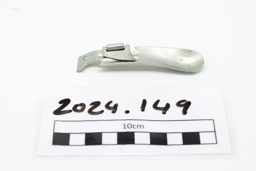 Combination can opener/spoon/bottle opener for preparing and consuming field rations