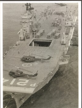 The image shows HMAS Sydney anchored in Vung Tau with two HUEY's on deck. 