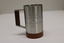 Pewter beer tankard with wooden base and handle insert and engraved dedication.