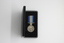 A miniature Australian Active Service medal presented in a black box with the ribbons and bars.