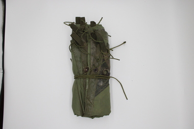 Standard army issue shelter with webbing ties and eyelets.