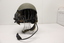 Khaki coloured helmet with built in headphones with wireless attachments.