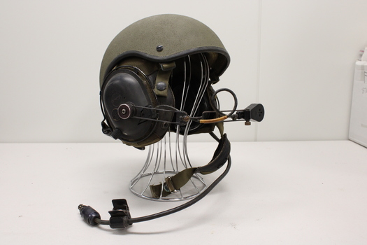 Side view of helmet with built in earphones and wireless attachments.