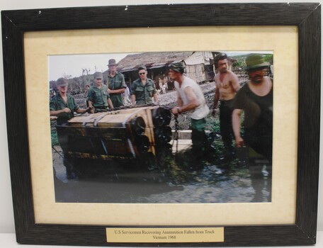 U.S. Servicemen Recovering Ammunition Fallen from Truck Vietnam 1968