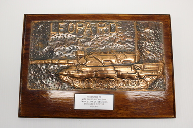Presented plaque with beaten copper image of leopard tank