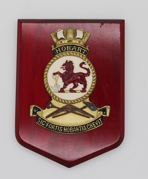 Plaque bearing the shield and emblem of the HMAS Hobart