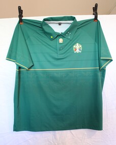 Green polo with 50th Anniversary insignia on left top. Southern cross stitched in white on left collar and yellow star on right collar.