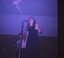 A coloured slide of a female singer and a guitarist named Ben